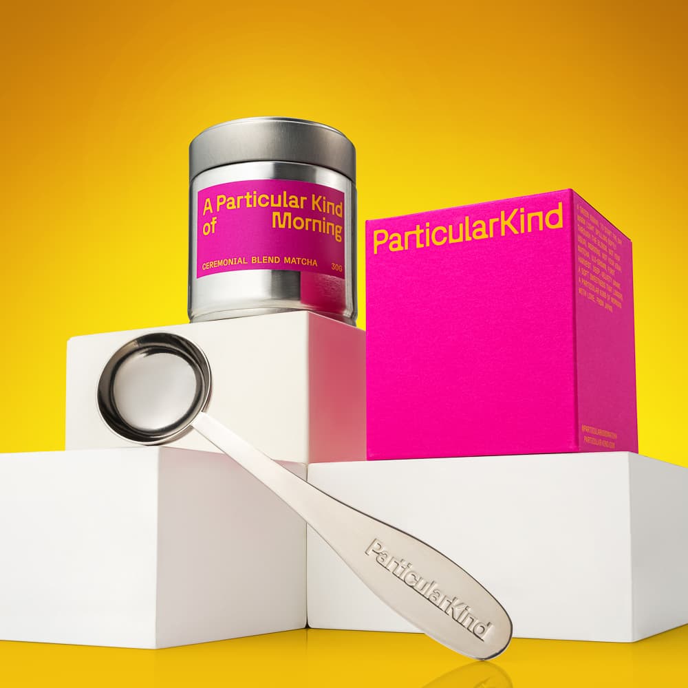 Bright matcha packaging and accessories on a yellow set