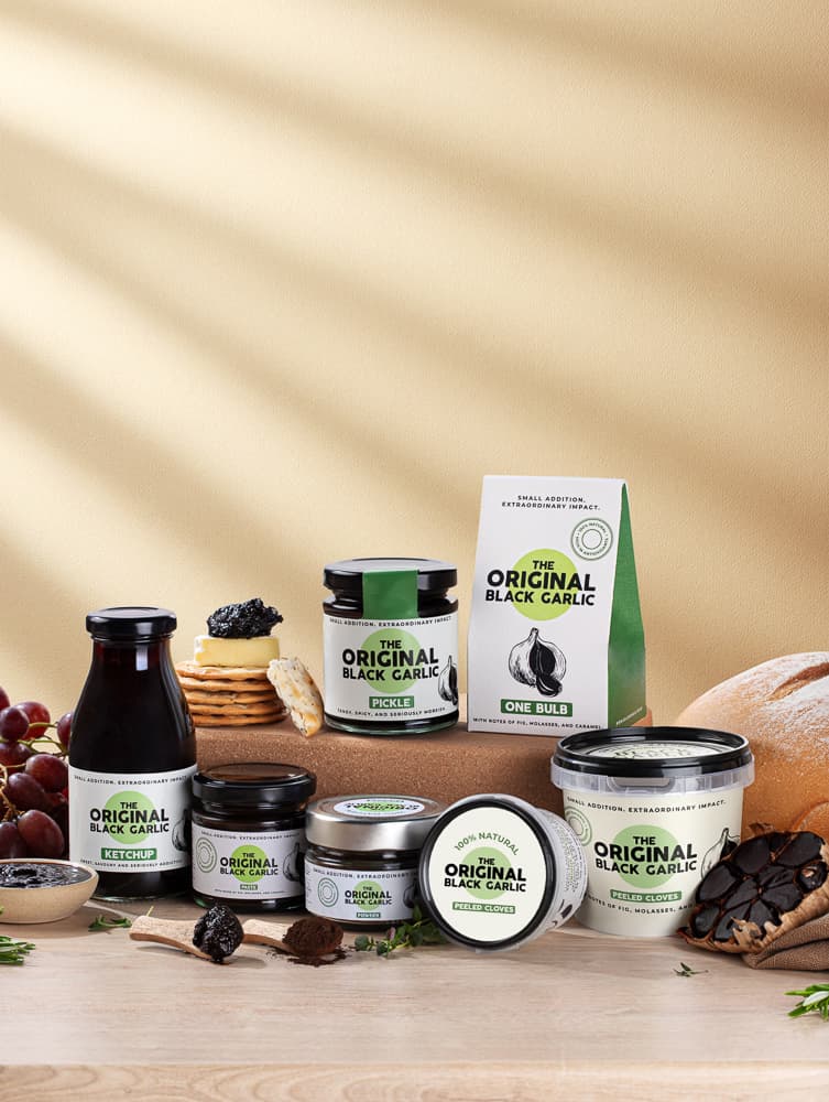 Black garlic product range styled vertical lifestyle photography - food styling UK