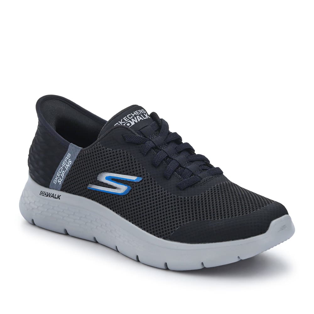 Black trainer on a light background showing the outer side