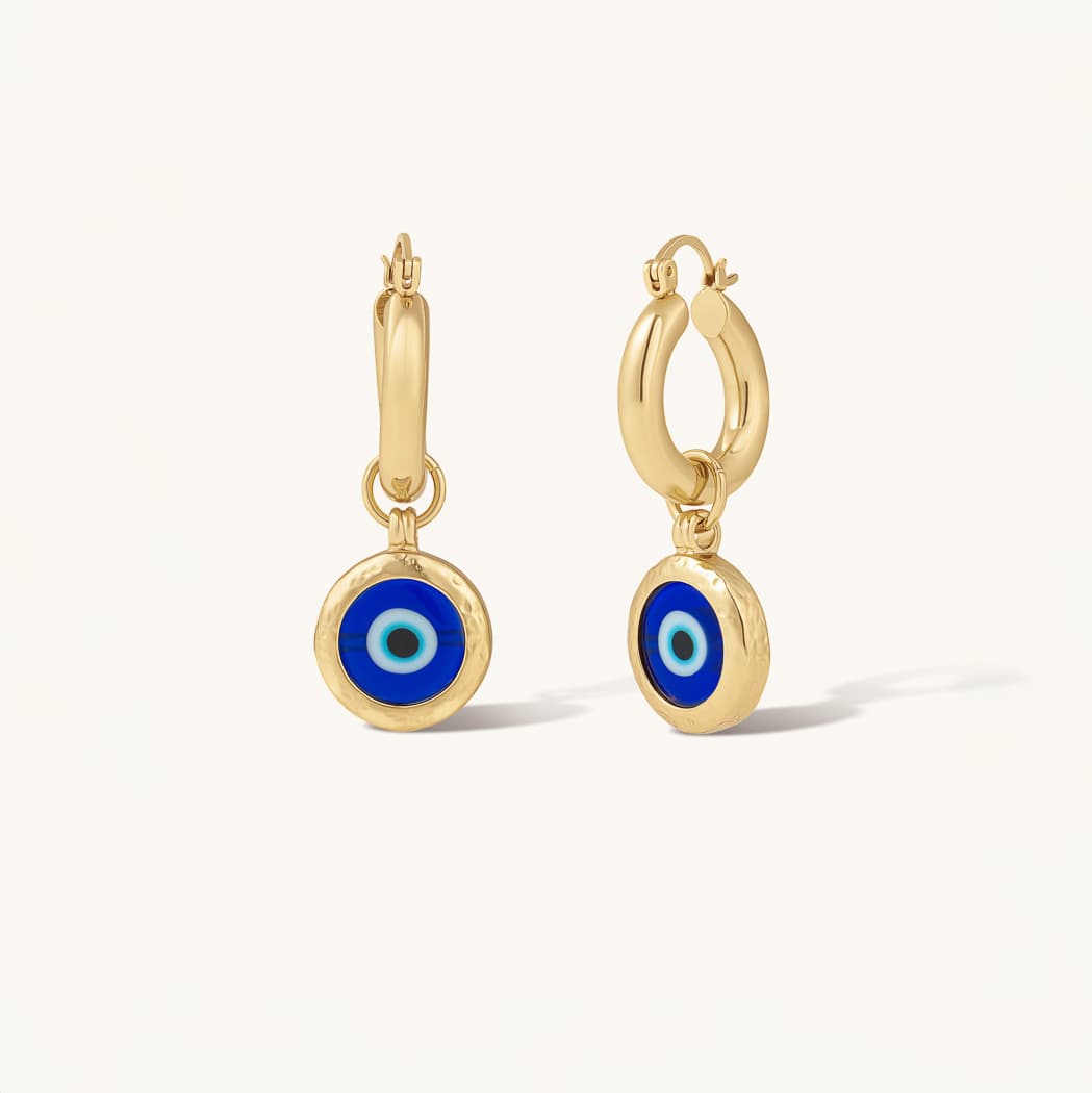 Pair of gold-tone earrings with blue eye pendants