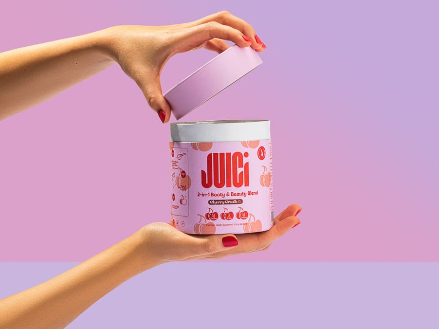 JUICI product held between hands against a purple background